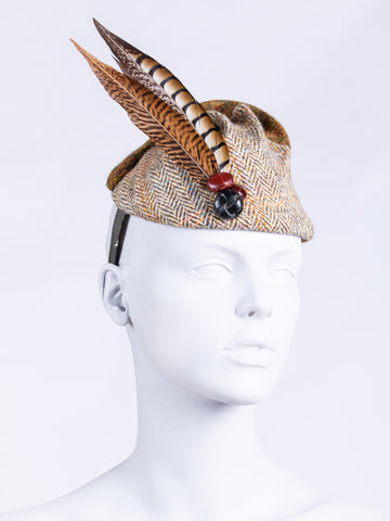 beige and moss green Harris Tweed hat with feathers