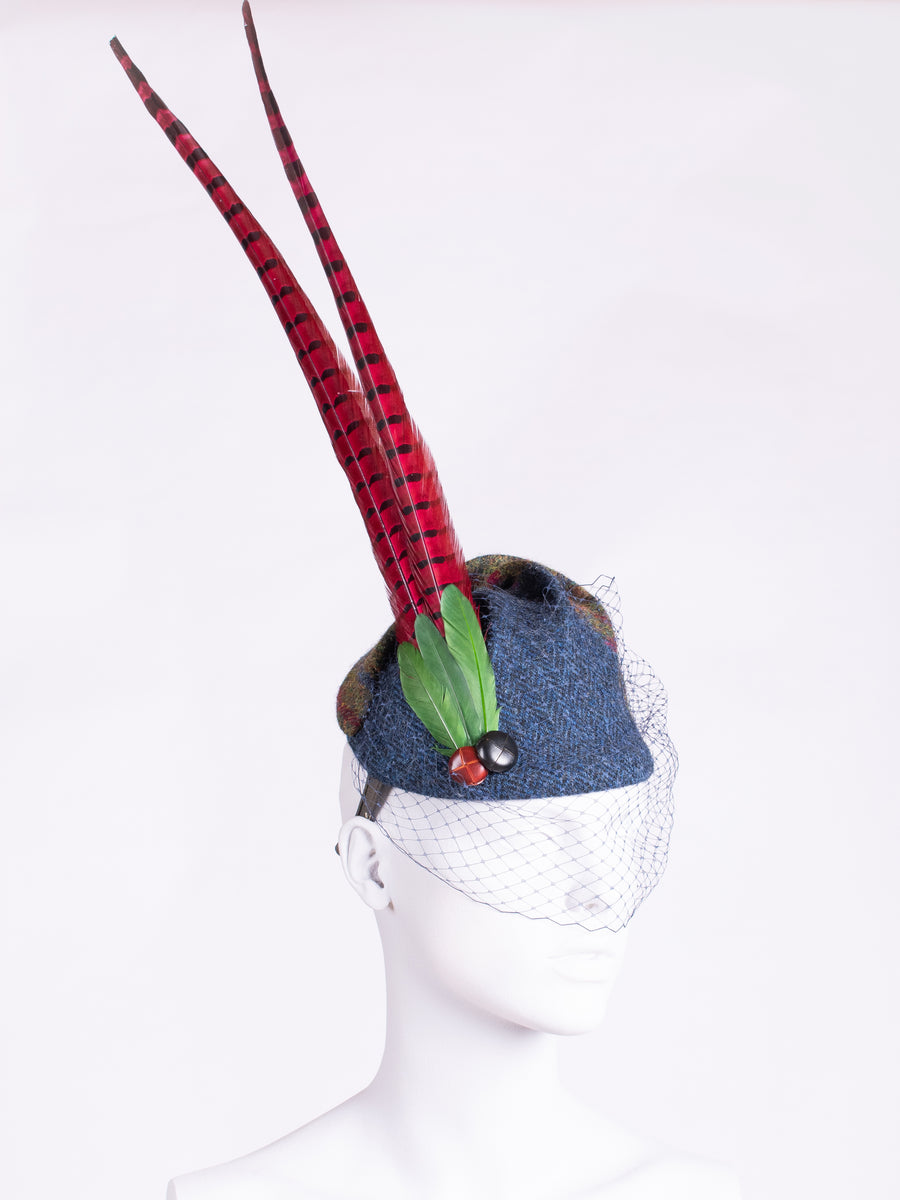 Navy blue and green Cheltenham hat with long feathers and veil